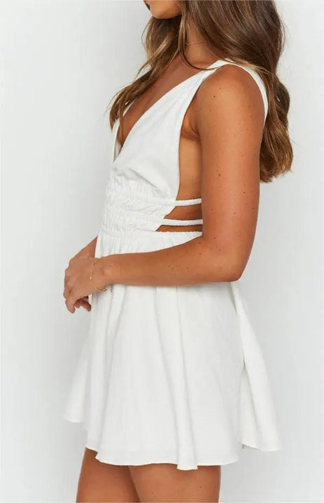 MINI VESTIDO SEXY,COM ABERTURA NAS COSTAS EM DECOTE EM V E COM ESTAMPA DE FLORES