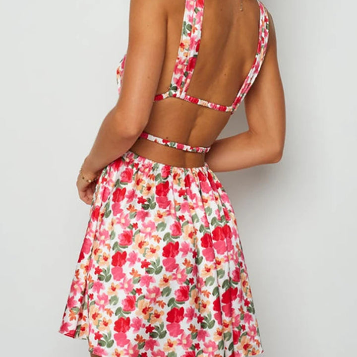 MINI VESTIDO SEXY,COM ABERTURA NAS COSTAS EM DECOTE EM V E COM ESTAMPA DE FLORES