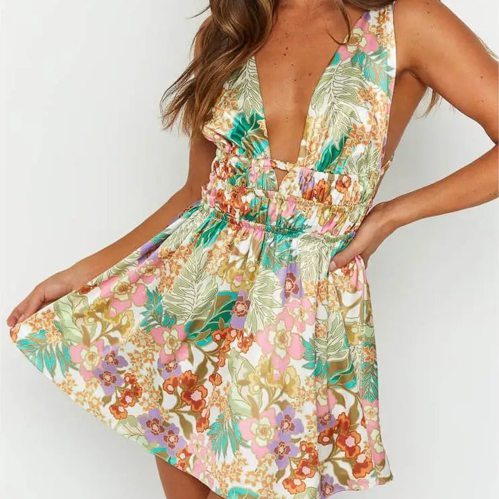 MINI VESTIDO SEXY,COM ABERTURA NAS COSTAS EM DECOTE EM V E COM ESTAMPA DE FLORES