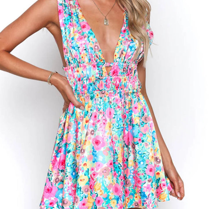MINI VESTIDO SEXY,COM ABERTURA NAS COSTAS EM DECOTE EM V E COM ESTAMPA DE FLORES