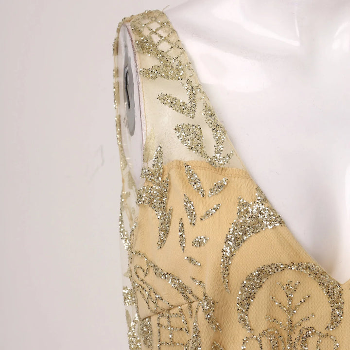 VESTIDO ELEGANTE COM DECOTE V COM LANTEJOULAS DOURADAS