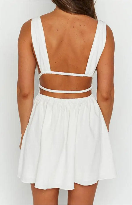 MINI VESTIDO SEXY,COM ABERTURA NAS COSTAS EM DECOTE EM V E COM ESTAMPA DE FLORES